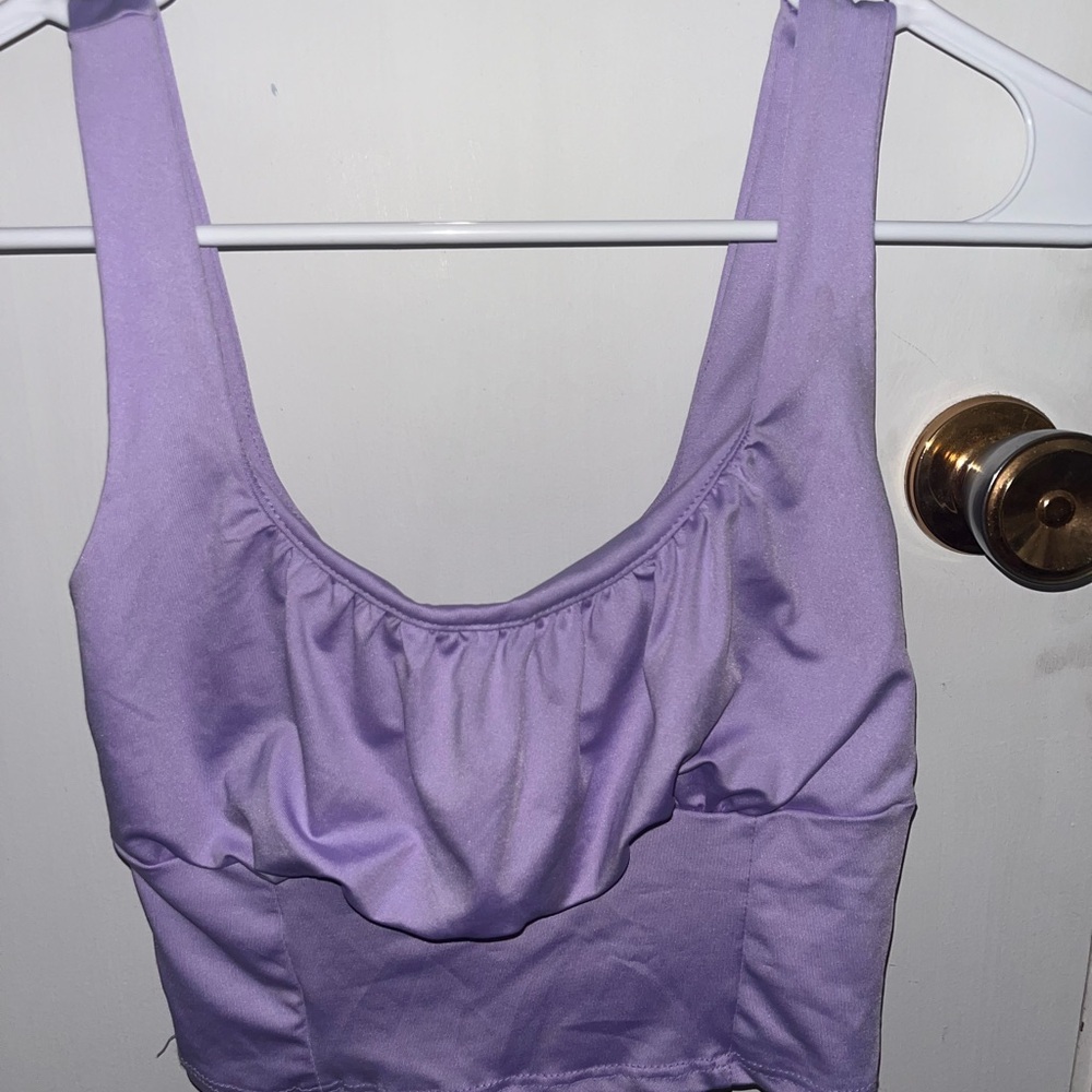 Purple crop top with a ruffle on the top